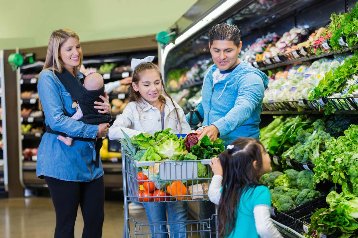 Family shopping for plant-based foods on a budget