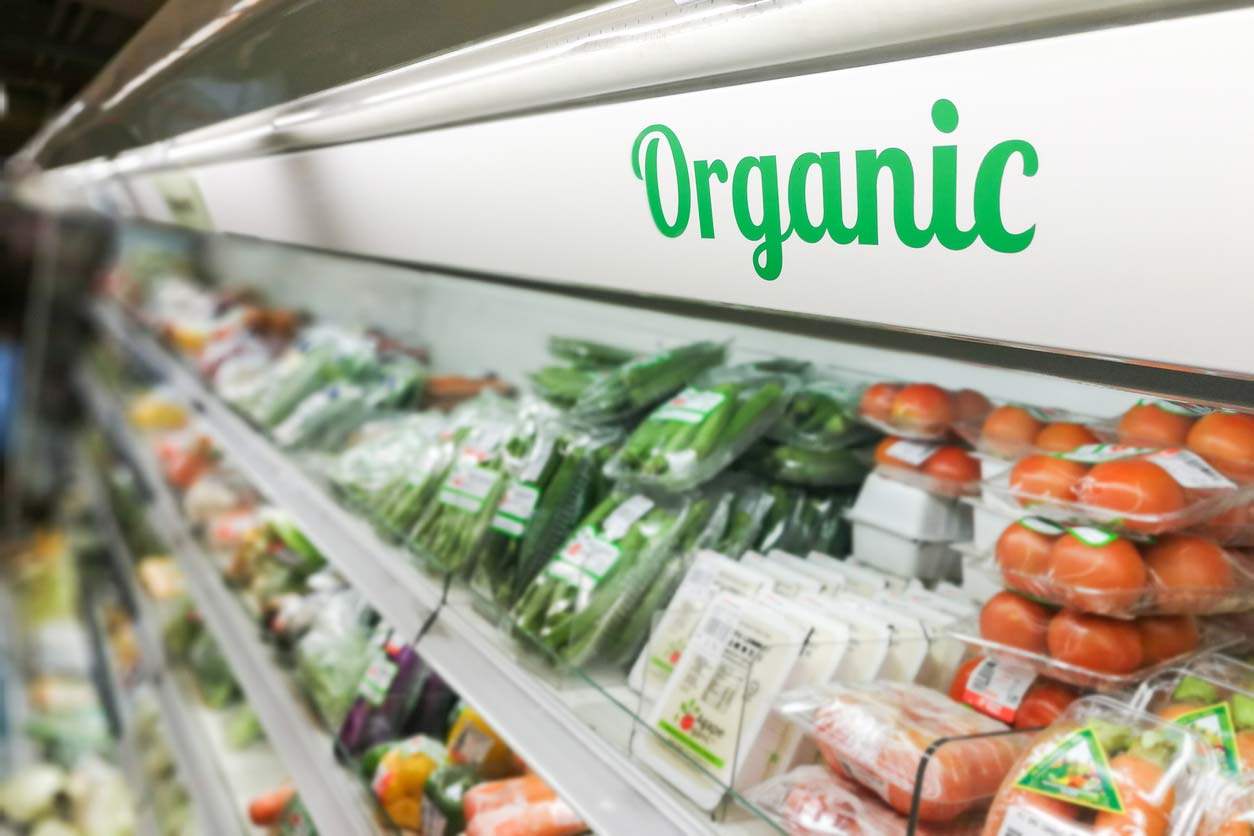 organic signage in refrigerated produce aisle