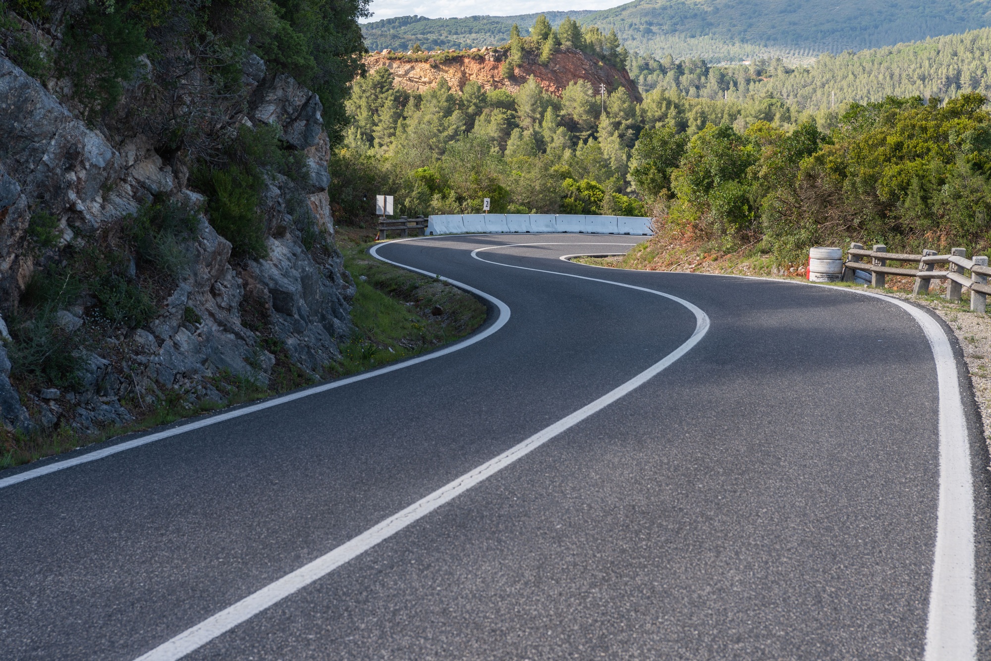 Beautiful view of a road passing through Arrabida mountains in Setubal, Portugal